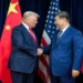 U.S. President Donald Trump greets Chinese leader Xi Jinping before a bilateral meeting in Busan, South Korea.