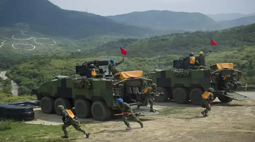 Former Taiwan President Tsai Ing-wen observes military personnel and equipment during the Han Kuang 32 military exercise in Pingtung County.