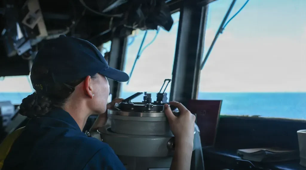A U.S. sailor stands watch on the bridge of the guided-missile destroyer USS John Finn (DDG 113) during Operation Epic Fury in the U.S. 5th Fleet area of responsibility.