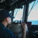 A U.S. sailor stands watch on the bridge of the guided-missile destroyer USS John Finn (DDG 113) during Operation Epic Fury in the U.S. 5th Fleet area of responsibility.