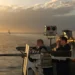 U.S. Navy sailor mans a .50-caliber machine gun aboard USS Kitty Hawk while transiting the Strait of Hormuz toward the Arabian Gulf.