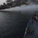 U.S. Navy sailors aboard USS William P. Lawrence prepare to provide rescue assistance to a burning vessel while transiting the Strait of Hormuz.