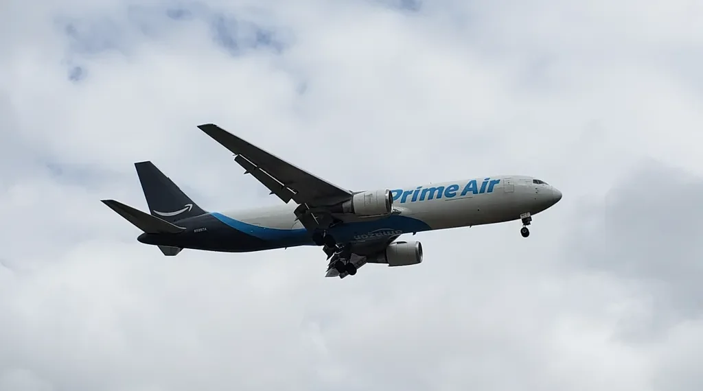 Amazon Air Boeing 767-300F operated by 21 Air approaches Miami International Airport in Miami, Florida.