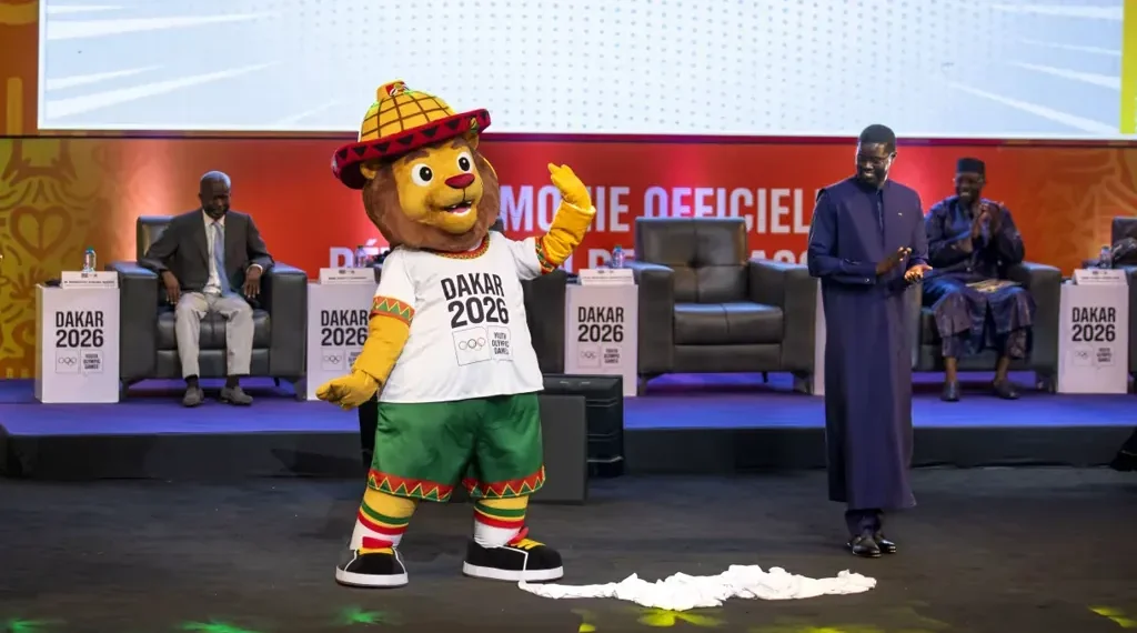 Ayo, the lion mascot of the Dakar 2026 Youth Olympic Games, representing Senegalese youth and the first Olympic event in Africa.