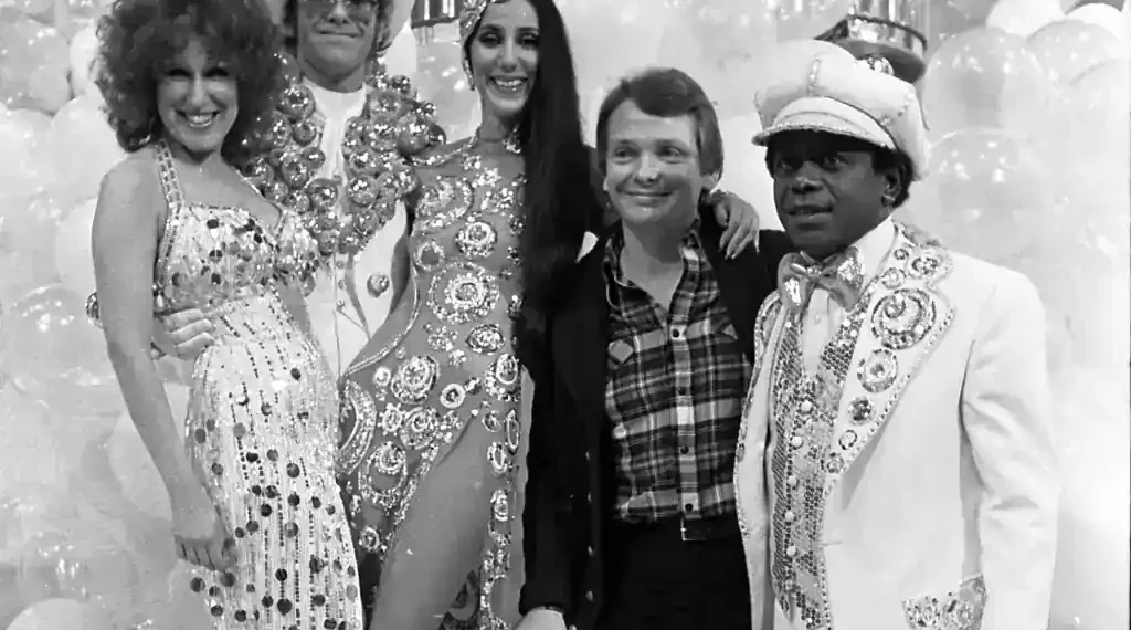 Bob Mackie poses with Bette Midler, Elton John, Cher and Flip Wilson during a 1975 television special taping at CBS Television City.