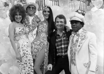 Bob Mackie poses with Bette Midler, Elton John, Cher and Flip Wilson during a 1975 television special taping at CBS Television City.