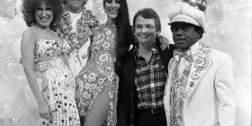 Bob Mackie poses with Bette Midler, Elton John, Cher and Flip Wilson during a 1975 television special taping at CBS Television City.