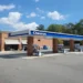 Chevron Super gas station sign and roadside fuel station visible in Sutallee, Georgia, United States.
