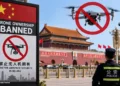 Police officers stand near Beijing landmarks as a drone ban sign highlights tighter airspace security measures in China.