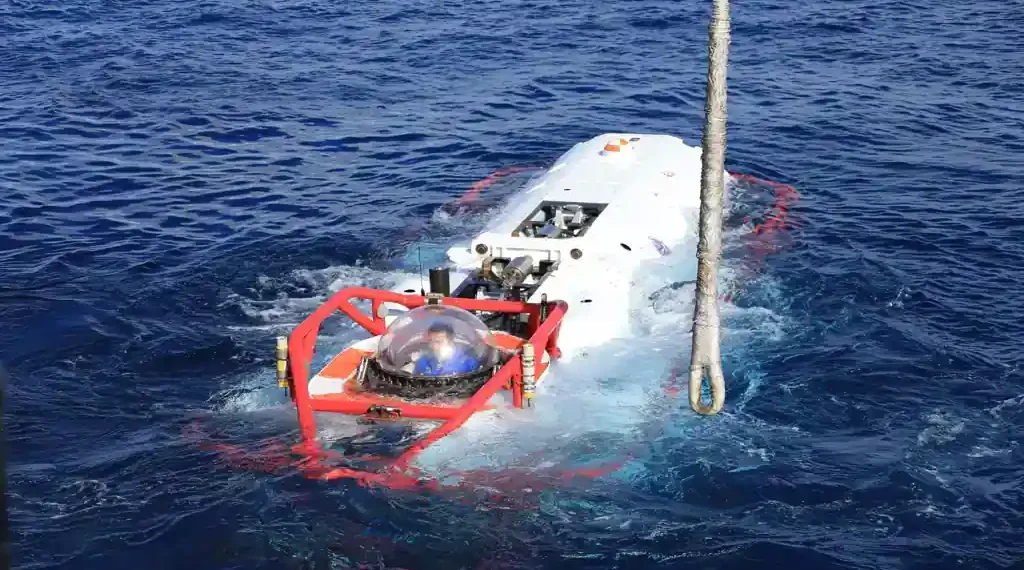 Chinese navy sailor sits inside an LR-7 undersea rescue vehicle during a multinational submarine rescue exercise off Hawaii.