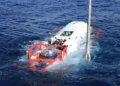 Chinese navy sailor sits inside an LR-7 undersea rescue vehicle during a multinational submarine rescue exercise off Hawaii.