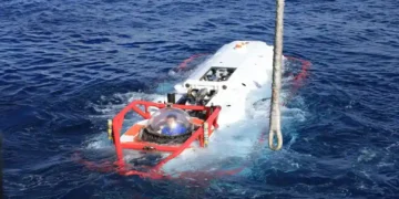 Chinese navy sailor sits inside an LR-7 undersea rescue vehicle during a multinational submarine rescue exercise off Hawaii.