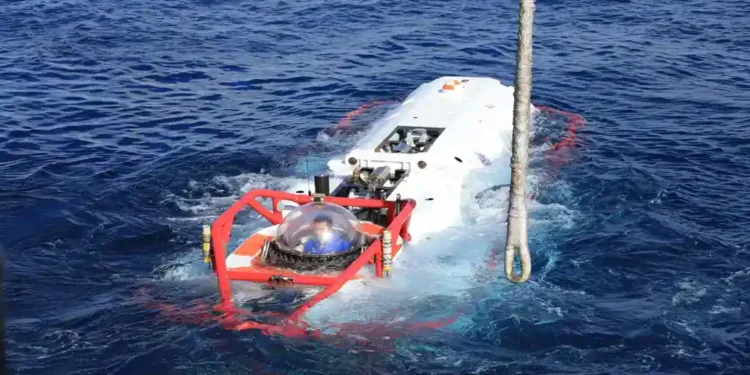Chinese navy sailor sits inside an LR-7 undersea rescue vehicle during a multinational submarine rescue exercise off Hawaii.
