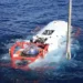 Chinese navy sailor sits inside an LR-7 undersea rescue vehicle during a multinational submarine rescue exercise off Hawaii.