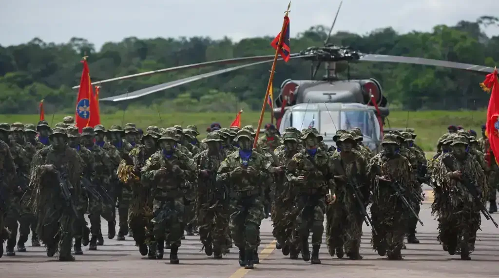 Colombian soldiers from the National Army Special Anti-drug Brigade move into position during an award ceremony in Larandia, Colombia.