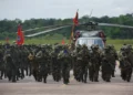 Colombian soldiers from the National Army Special Anti-drug Brigade move into position during an award ceremony in Larandia, Colombia.