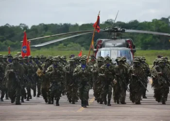 Colombian soldiers from the National Army Special Anti-drug Brigade move into position during an award ceremony in Larandia, Colombia.