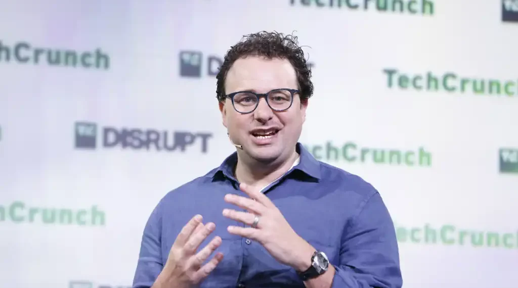 Dario Amodei speaks at TechCrunch Disrupt 2023 during a technology industry event in San Francisco, California.