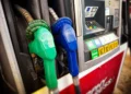 Diesel fuel pump at a gas station displaying fueling equipment and pricing information.