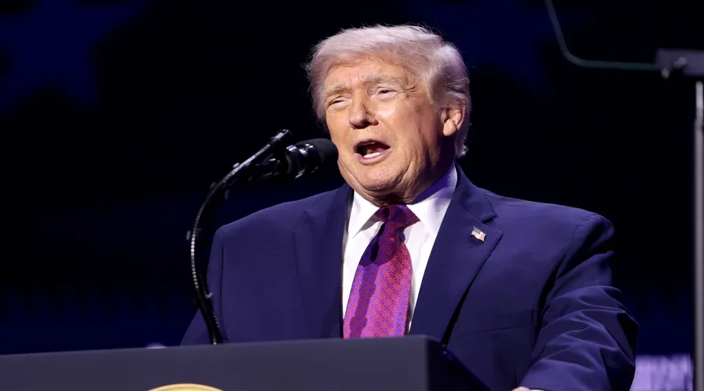 President Donald Trump speaks with attendees at the Build the Red Wall rally at Dream City Church in Phoenix, Arizona.