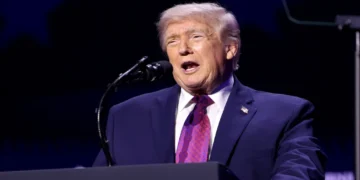 President Donald Trump speaks with attendees at the Build the Red Wall rally at Dream City Church in Phoenix, Arizona.