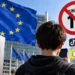 European Union flag and European Commission building behind a teenager with social media icons and an under-15 restriction symbol.
