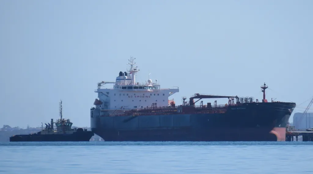 Oil and chemical tanker Gulf Muttrah departs the BP Oil Refinery jetty with tugboat assistance in Kwinana, Western Australia.