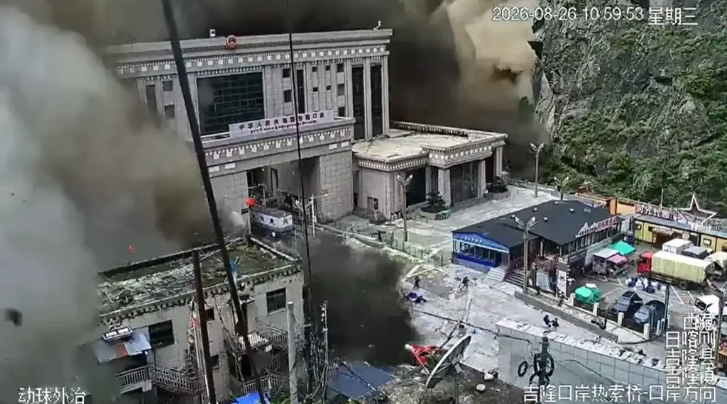 CCTV screenshot shows a mudslide at Gyirong Port during flooding, viewed south downstream on August 26, 2026.