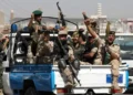 Houthi troops ride on a police patrol truck after participating in a Houthi gathering in Sanaa, Yemen, on February 19, 2020.