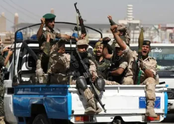 Houthi troops ride on a police patrol truck after participating in a Houthi gathering in Sanaa, Yemen, on February 19, 2020.