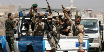 Houthi troops ride on a police patrol truck after participating in a Houthi gathering in Sanaa, Yemen, on February 19, 2020.