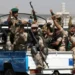 Houthi troops ride on a police patrol truck after participating in a Houthi gathering in Sanaa, Yemen, on February 19, 2020.