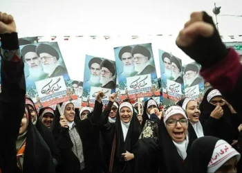 Iranian girls participate in the 22 Bahman rally marking the anniversary of Iran’s Islamic Revolution in Tehran on February 10, 2017.