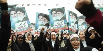 Iranian girls participate in the 22 Bahman rally marking the anniversary of Iran’s Islamic Revolution in Tehran on February 10, 2017.