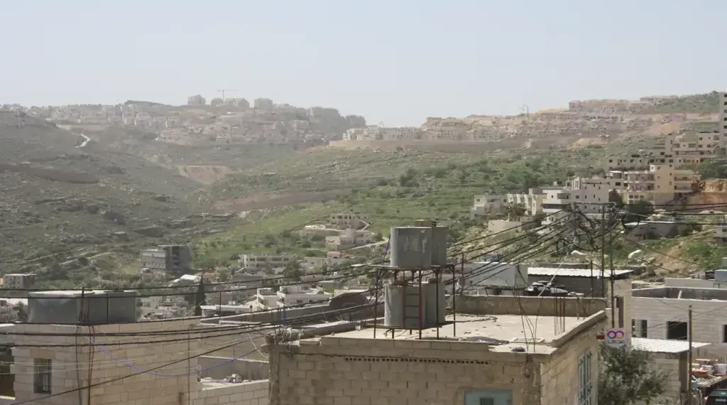 Israeli settlements are visible on hills southwest of Dheisheh refugee camp in the West Bank, Palestine, photographed in March 2018.