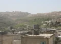 Israeli settlements are visible on hills southwest of Dheisheh refugee camp in the West Bank, Palestine, photographed in March 2018.