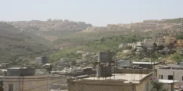 Israeli settlements are visible on hills southwest of Dheisheh refugee camp in the West Bank, Palestine, photographed in March 2018.