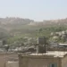 Israeli settlements are visible on hills southwest of Dheisheh refugee camp in the West Bank, Palestine, photographed in March 2018.