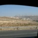 Two Israeli settlements are visible on hills in the West Bank, viewed from a Palestinian road during a 2008 journey.