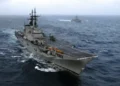 Italian aircraft carrier ITS Giuseppe Garibaldi and Turkish frigate TCG Gediz sail through the Atlantic Ocean during Majestic Eagle 2004.