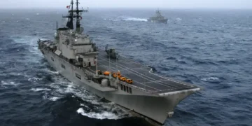 Italian aircraft carrier ITS Giuseppe Garibaldi and Turkish frigate TCG Gediz sail through the Atlantic Ocean during Majestic Eagle 2004.