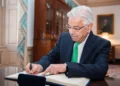 Pakistani foreign minister signs U.S. secretary of state’s guestbook before a meeting at the State Department in Washington, D.C.