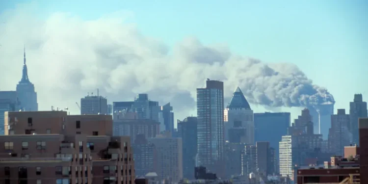 Manhattan skyline with smoke billowing from the Twin Towers after the September 11, 2001 terrorist attacks in New York City