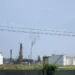 Oil refinery near Regla in Havana, Cuba, viewed from the surrounding area with industrial processing structures visible.
