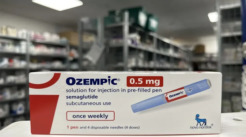 Ozempic semaglutide 0.5 mg packaging displayed in a pharmacy, photographed in August 2023.