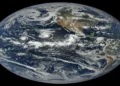 Satellite view of tropical cyclones Lowell, Karina and Marie swirling over the Pacific Ocean west of Central America.