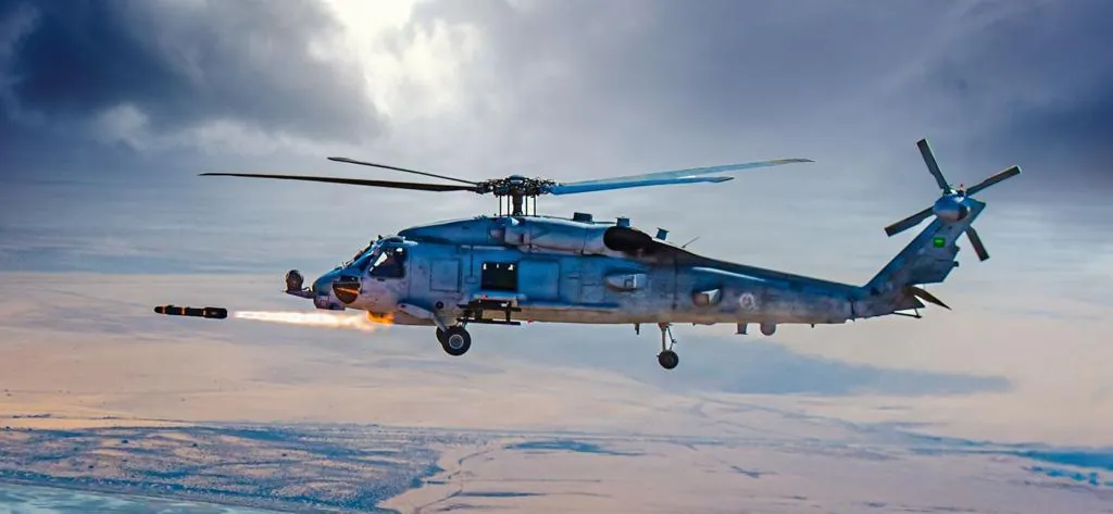 MH-60R Seahawk helicopter assigned to Royal Saudi Naval Forces fires an AGM-114 Hellfire missile near Jubail Naval Air Base, Saudi Arabia.