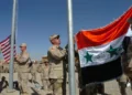 U.S. and Iraqi Army soldiers observe Veterans Day at Forward Operating Base Sykes in Tall Afar, Iraq, on November 11, 2005.
