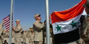 U.S. and Iraqi Army soldiers observe Veterans Day at Forward Operating Base Sykes in Tall Afar, Iraq, on November 11, 2005.