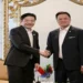 Two prime ministers shake hands during the Thailand–Singapore Leaders’ Retreat at a government venue in Bangkok.